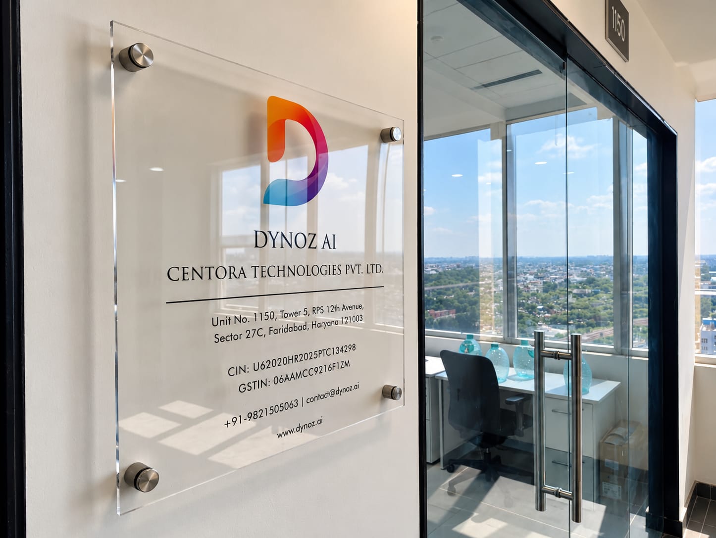 The Dynoz AI plaque on the glass beside the office door, the room and the city visible through it.